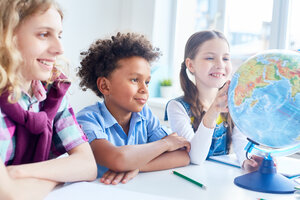 Children and a globe