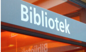 En skylt med texten "bibliotek"