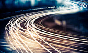 Smeared car headlights on a freeway at night