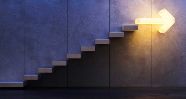 Staircase with a arrow formed light in the end, pointing forwards